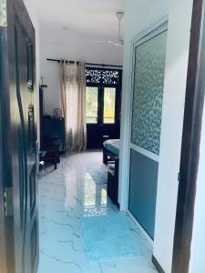 a room with a hallway with a door and a room with at Center Point Villa Unawatuna in Unawatuna