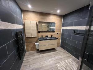 a bathroom with a sink and a mirror at maison guy in Priay +26 photos