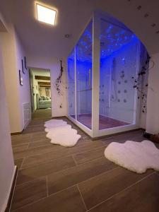 a room with some white rugs on the floor at Escape Private SPA II in Bad Zurzach