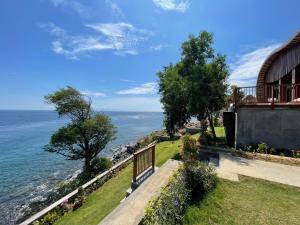 a view of the ocean from a house at The Angsa villas in Amed