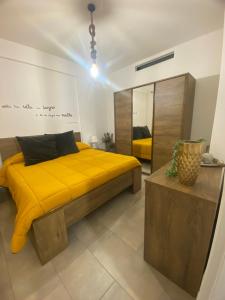 Postel nebo postele na pokoji v ubytování Cala Holidays vicino Aeroporto&Mare + 37 fotografií
