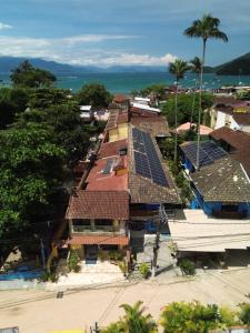 an aerial view of a village with solar panels on roofs at Pousada Juliana in Abraão