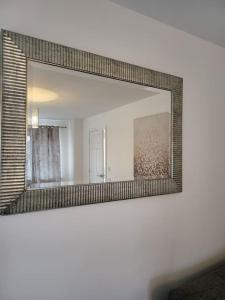 a mirror on a wall in a room at Moorgreen 