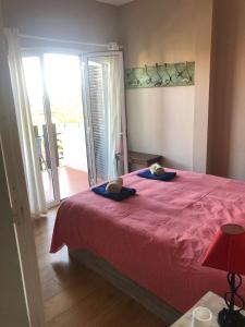 En eller flere senge i et værelse på Cosy Tavira Holidays