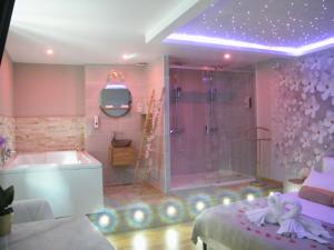 a pink bathroom with a shower and a tub and a sink at Studio Love Spa Baignoire XXL Port Vieux La Ciotat in La Ciotat