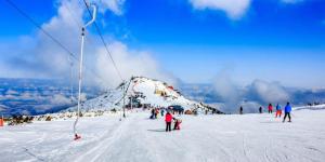 a group of people on a snow covered mountain at Forest Apartment/ Villa Park in Borovets