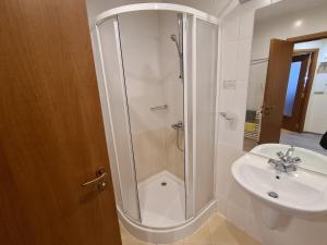 a bathroom with a shower and a sink at Forest Apartment/ Villa Park in Borovets +19 photos
