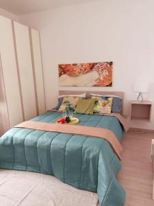a bedroom with a bed with a table on it at Casaagnese in Catania