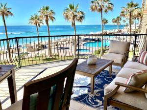 a balcony with a view of the beach and the ocean at Sonoran Sea Resort BEACHFRONT Condo E203 in Puerto Peñasco