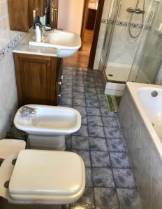 a bathroom with a toilet and a sink and a shower at Torre degli Alessandri in Viterbo +55 photos