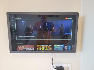 a television screen with a video game on it at Cosy ocean view studio 2 in San Marcos