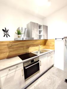 a kitchen with a sink and a stove at Steinstraße alt gelöscht in Bad Salzuflen