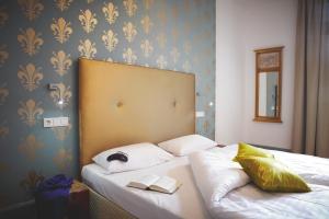 Postel nebo postele na pokoji v ubytování Hotel Tannhäuser