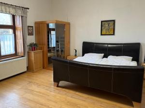 Postel nebo postele na pokoji v ubytování Apartmánové ubytovanie POD DUBOM