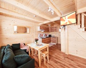 a living room with a couch and a table at Sielanka u Basi in Toporzysko