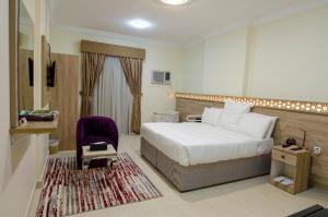 Giường trong phòng chung tại فندق درة بيسان