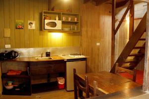 Køkken eller tekøkken på Cabañas Recanto