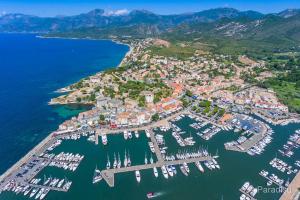 an aerial view of a harbor with boats at Face à la mer in Saint-Florent