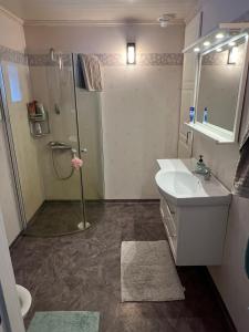 a bathroom with a shower and a sink at Villa Garpenberg in Garpenberg