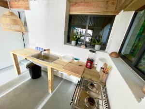 a kitchen with a sink and a washing machine at Blue in Clifton