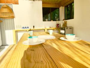 a kitchen with a wooden table with two bowls on it at Blue in Clifton