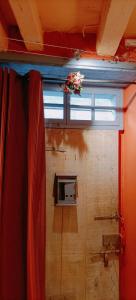 a window in a room with a curtain at Gîte Groupe La Farigoule à Siguer in Siguer