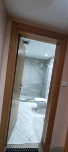 a bathroom with a toilet in a room at درة المكرونة للوحدات السكنية - Durrat Al-Makarona Residential Units in Jeddah