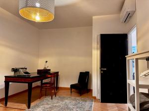 an office with a desk and a phone on a table at Charm & History in Trieste in Trieste