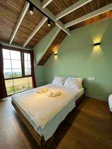 Ένα ή περισσότερα κρεβάτια σε δωμάτιο στο Mayanbungalows sapanca +47 φωτογραφίες