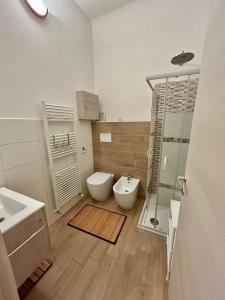 a bathroom with a toilet and a sink and a shower at RESIDENCE ZAR 4 in Trieste