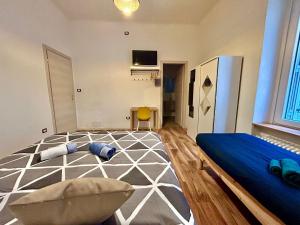a bedroom with a bed and a chair in it at RESIDENCE ZAR 4 in Trieste