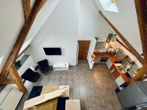 an overhead view of a kitchen and a living room at Duplex + parking gratuit facile in Sainte-Suzanne