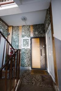a hallway with a door in a building at Apartman Milos free parking in Kraljevo