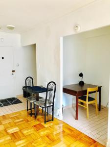 a dining room with a table and chairs at Stylish Montreal Apartment: Comfortable Stay in the Golden Square Mile in Montreal