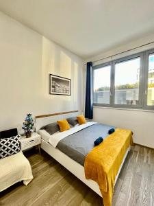 a bedroom with a large bed and a window at VIT Apartment - Free Parking - O2 Arena in Prague