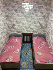 Una cama o camas en una habitación de Maftuna Guest Apartment 3