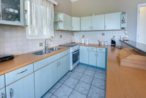 Kuchyň nebo kuchyňský kout v ubytování Villa Estia