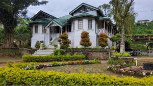 a house with a garden in front of it at Walauwa on the hill in Hatton