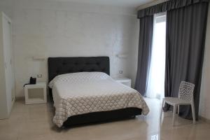 Postel nebo postele na pokoji v ubytování Hotel Presidente