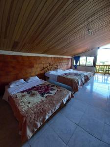 Postel nebo postele na pokoji v ubytování Eco Hotel Manu Viajeros
