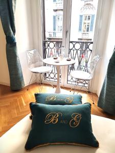 a couple of pillows sitting on the floor in a room at B and G San Babila luxury in the heart of Milano - Design district in Milan