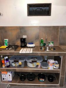 a kitchen with a sink and a counter top at Casa colonial Rosa San Antonio in Cali