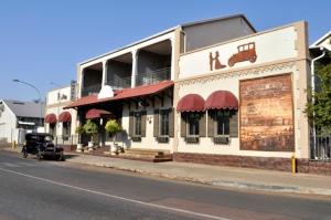 an old car is parked in front of a building at Premier Hotel and Spa Cullinan in Cullinan