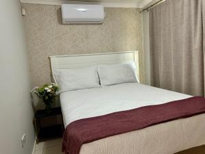 Postel nebo postele na pokoji v ubytování TRS Apartments + 1 fotografie