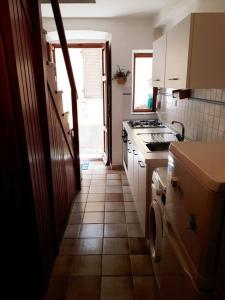 a kitchen with a sink and a stove at Casa elbana in Marciana