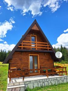 a log cabin with a gambrel roof at House Bojana in Žabljak