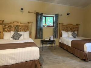 Katil atau katil-katil dalam bilik di Hotel Quinta Minera