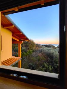 a window view of the ocean from a house at B&B Casa MariLù in Fuscaldo