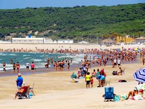 a large crowd of people on a beach at Casa Camarinero - Reformado in Barbate