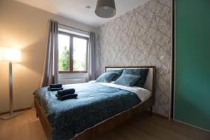Posteľ alebo postele v izbe v ubytovaní Cze Chill House - Dom na Kaszubach